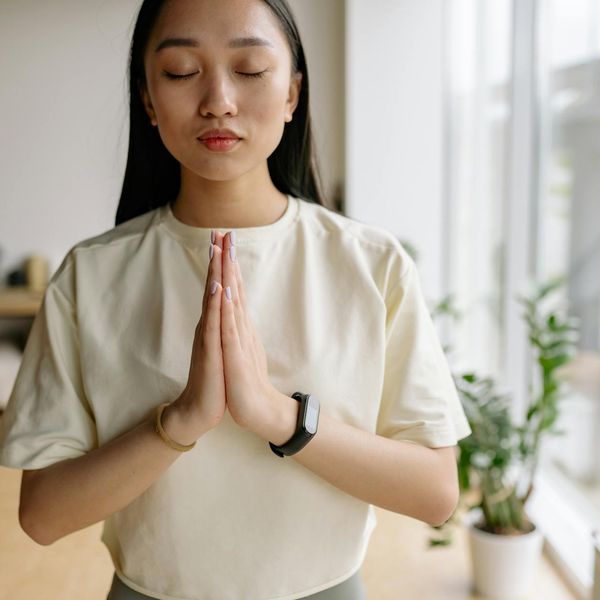Person meditating in a calm environment, focusing on their breath.